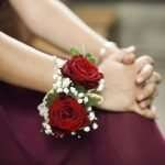 Bridesmaid holding a beautiful rose corsage