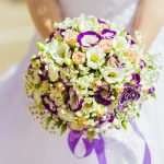 Bride holding colorful wedding bouquet