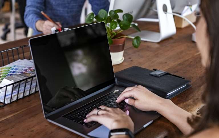 Businesswoman conducting virtual meeting via laptop