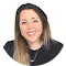 Smiling woman with long hair, professional headshot.