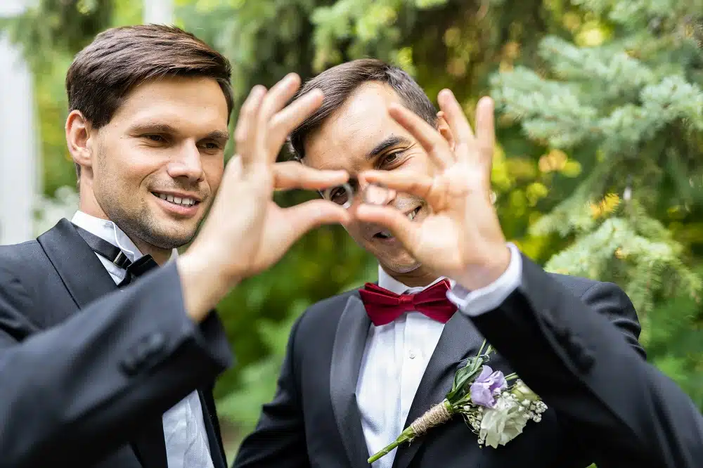 Gay couple joyfully celebrating their wedding