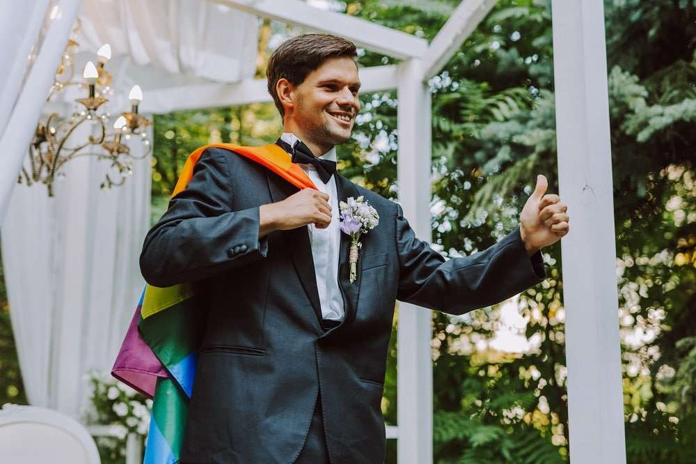 Wedding officiant performing ceremony at outdoor venue