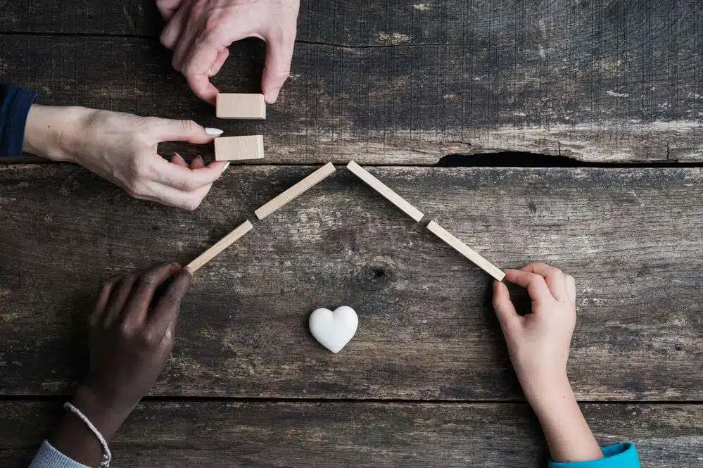 Family holding hands symbolizing adoption concept