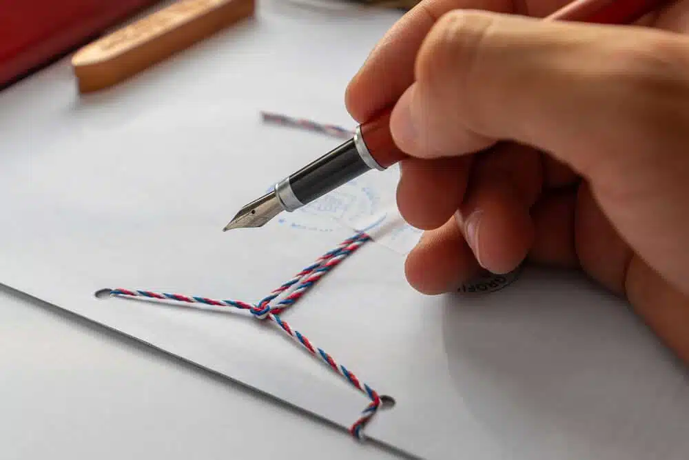 Notary public wax stamper on a white envelope