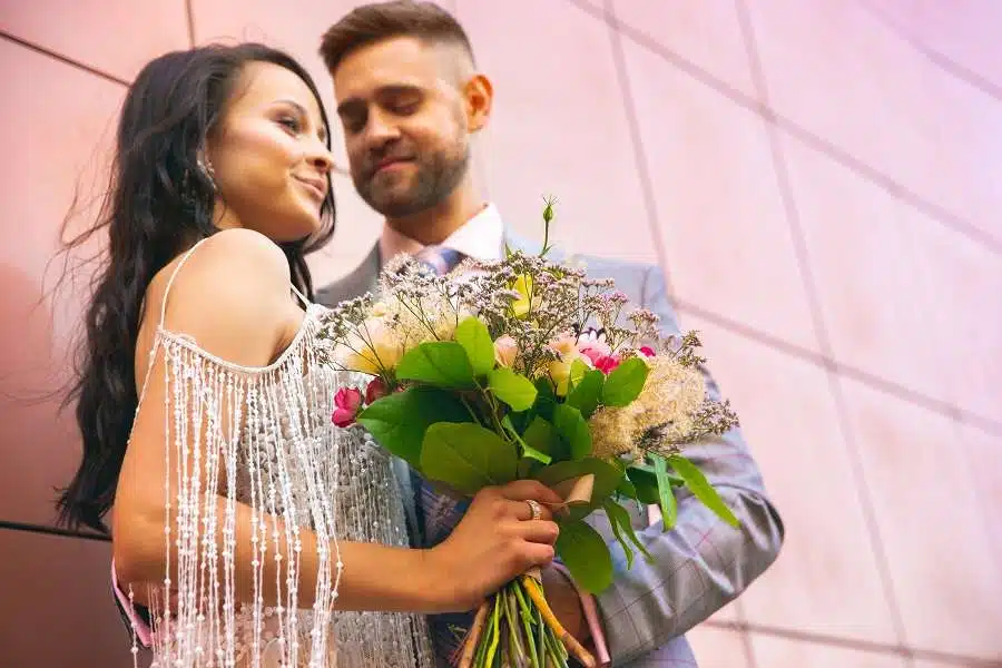 Couple exchanging rings during wedding ceremony