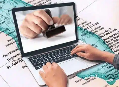 Person using laptop for online navigation research.