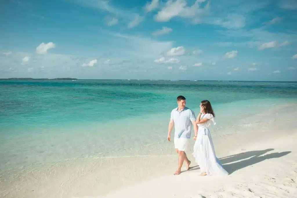 couple walking near beach